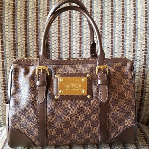 louis vuitton backpack with gold plate on front